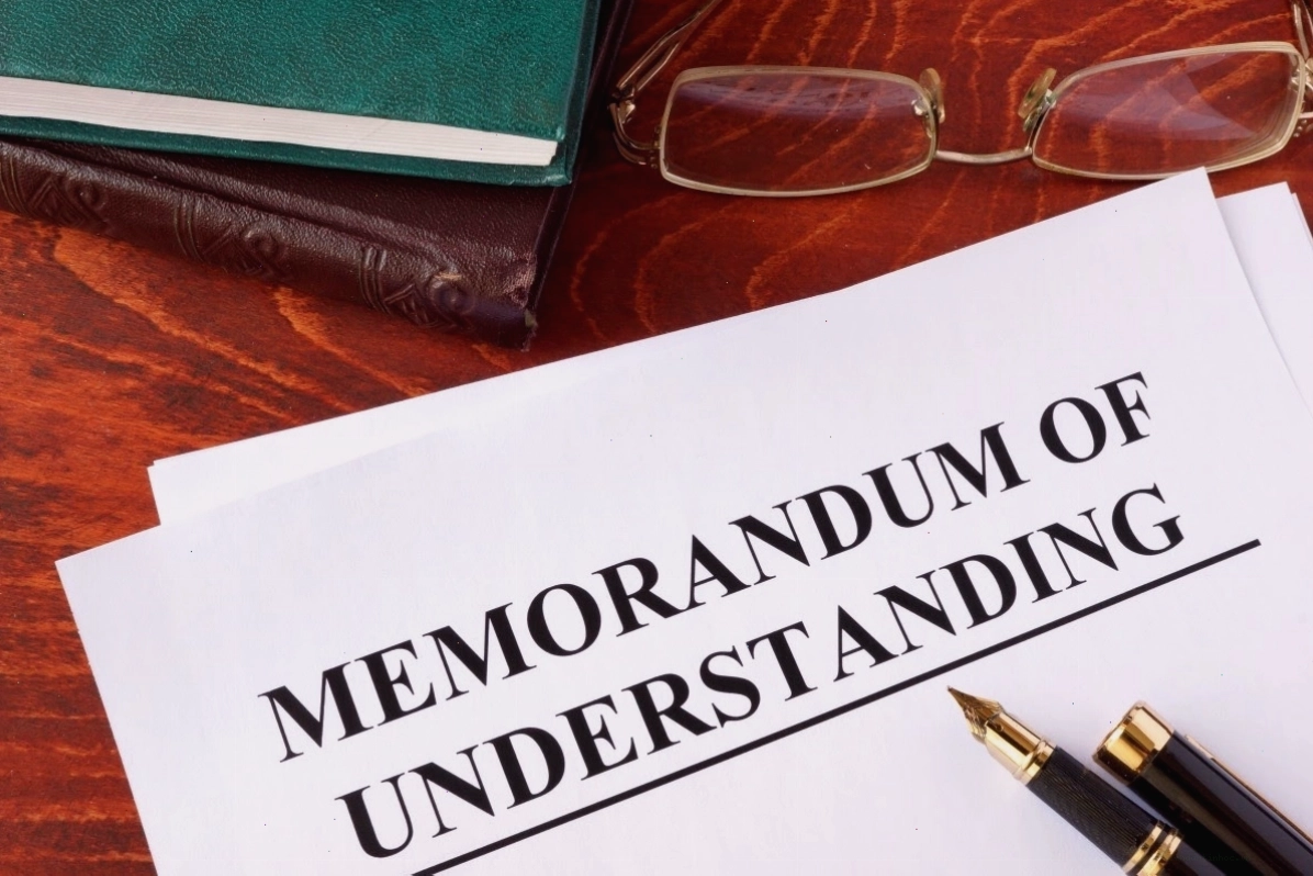 MOU là gì? Hình ảnh minh họa khái niệm biên bản ghi nhớ.