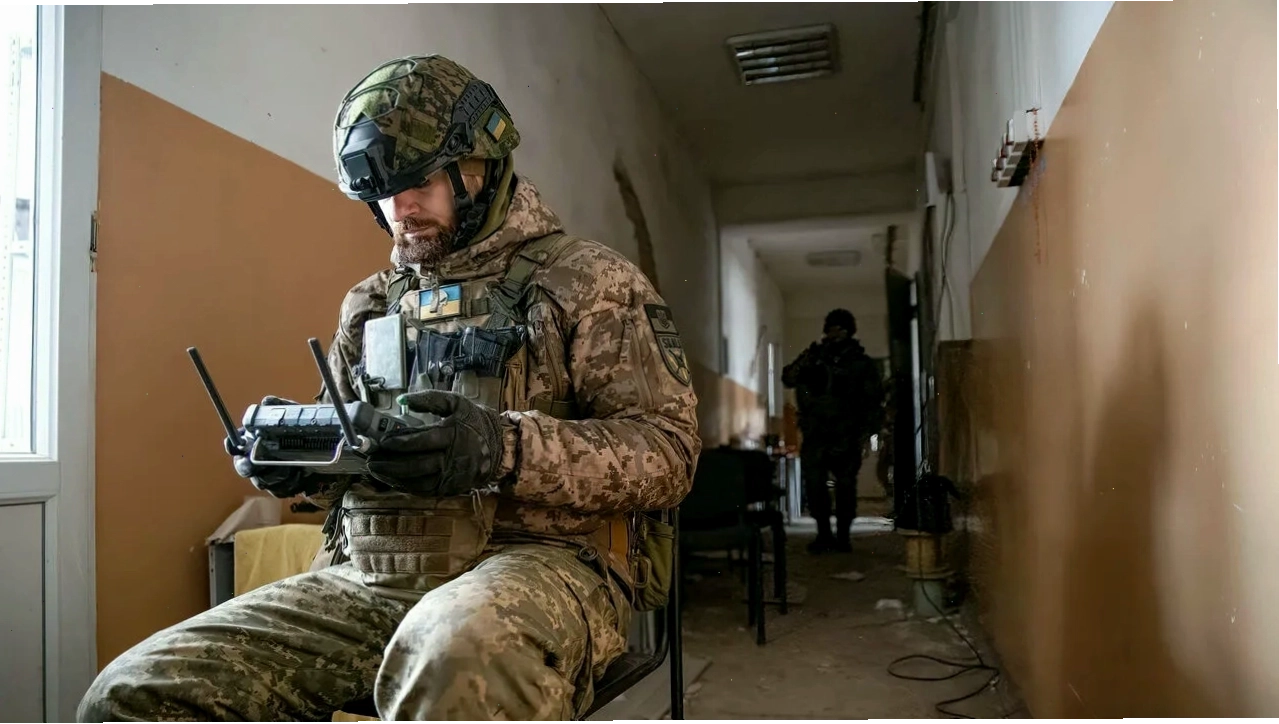 Ukrainian drone operator coordinating operations, highlighting the application of technology