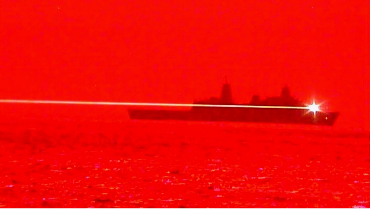 USS Portland conducting a laser weapon system test, demonstrating advanced technological applications